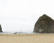 Haystack Rock Haystack Rock. Notice the people walking on the beach